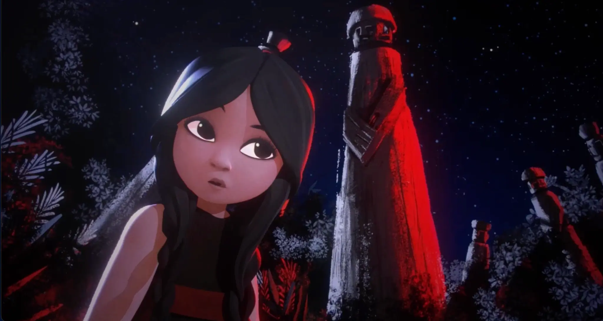 A girl between two illuminated stone figures in Frontera.